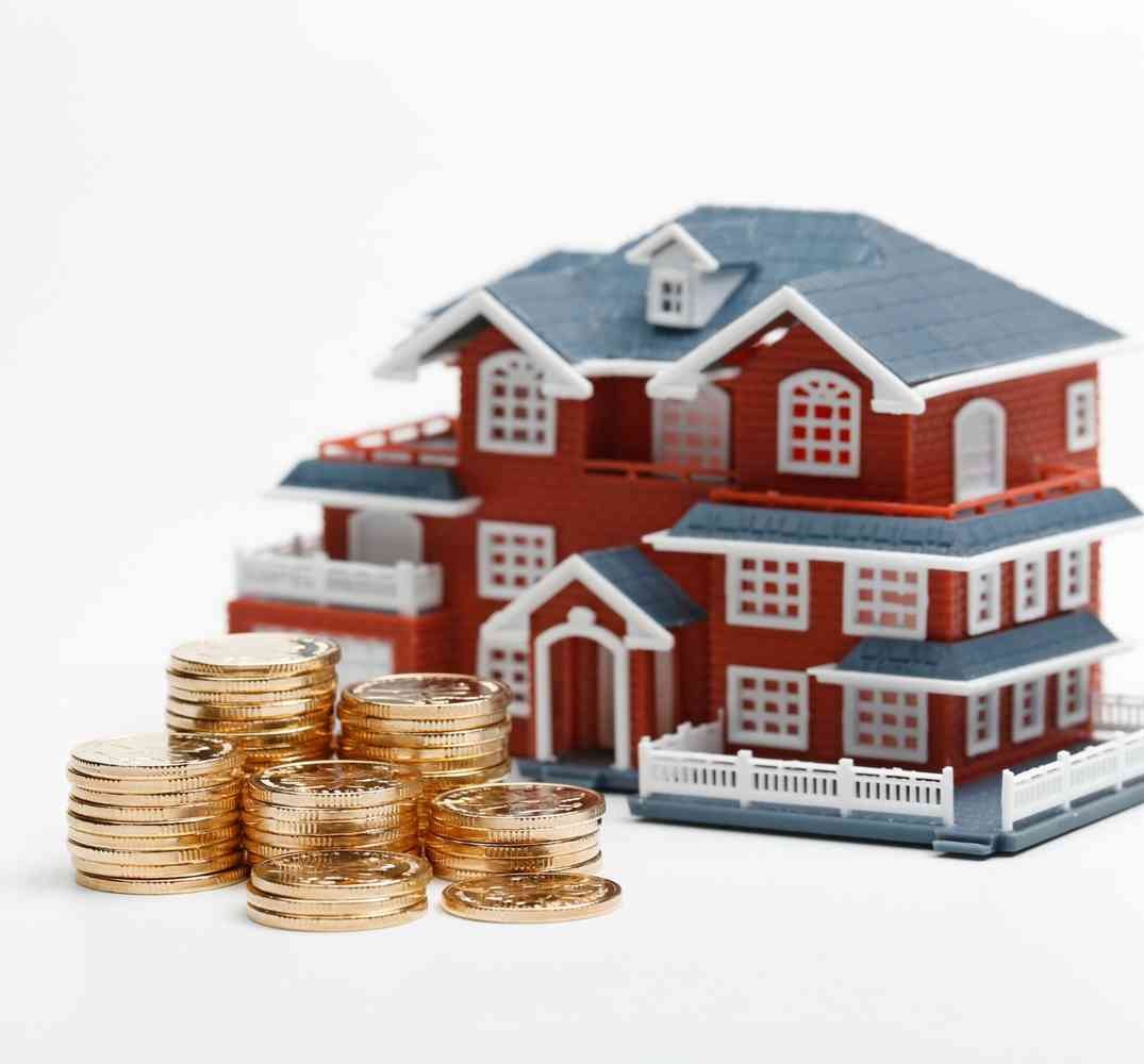 rmb-coins-stacked-front-housing-model-house-prices-house-buying-real-estate-mortgage-concept (1)